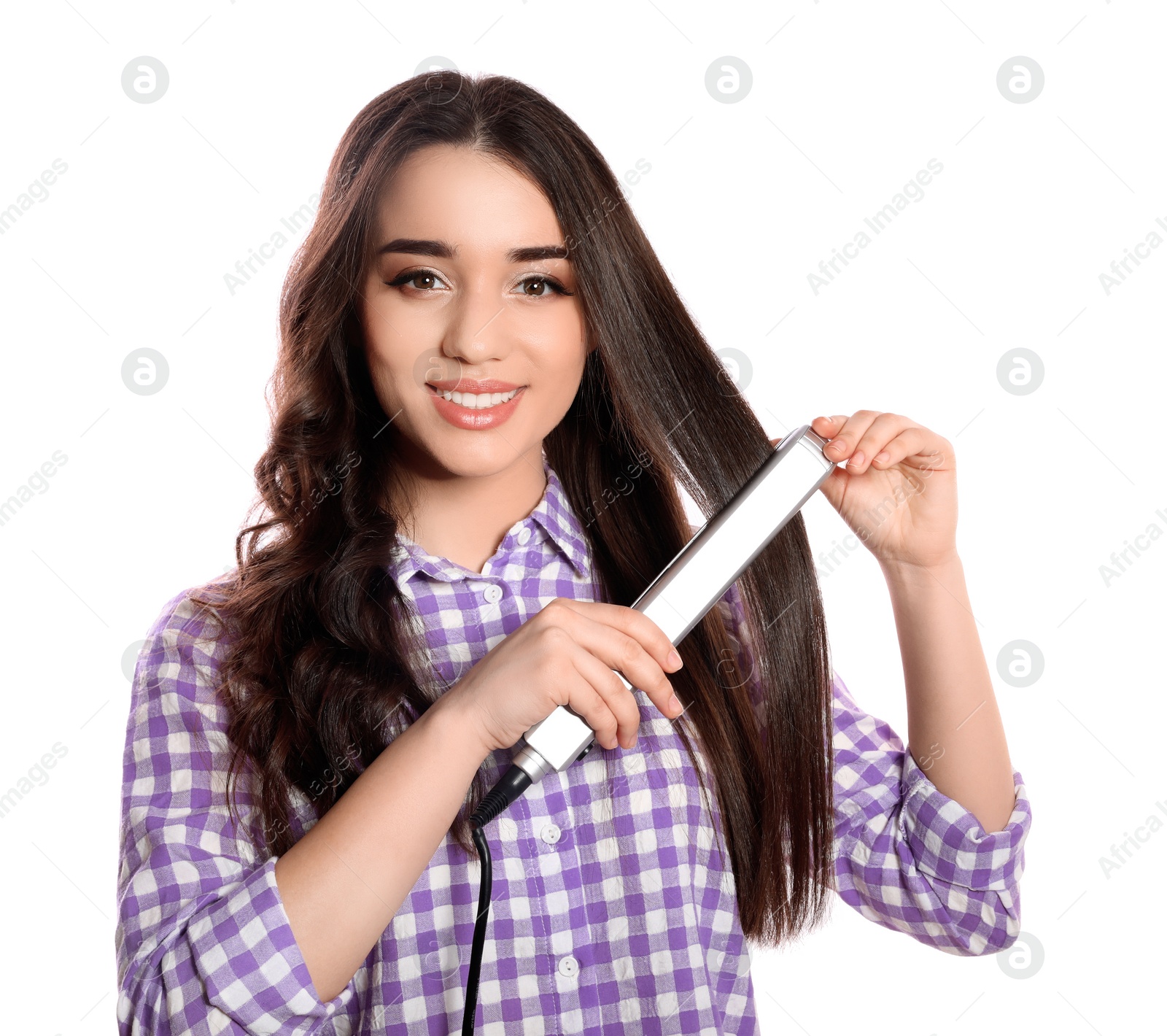 Photo of Happy woman using hair iron on white background