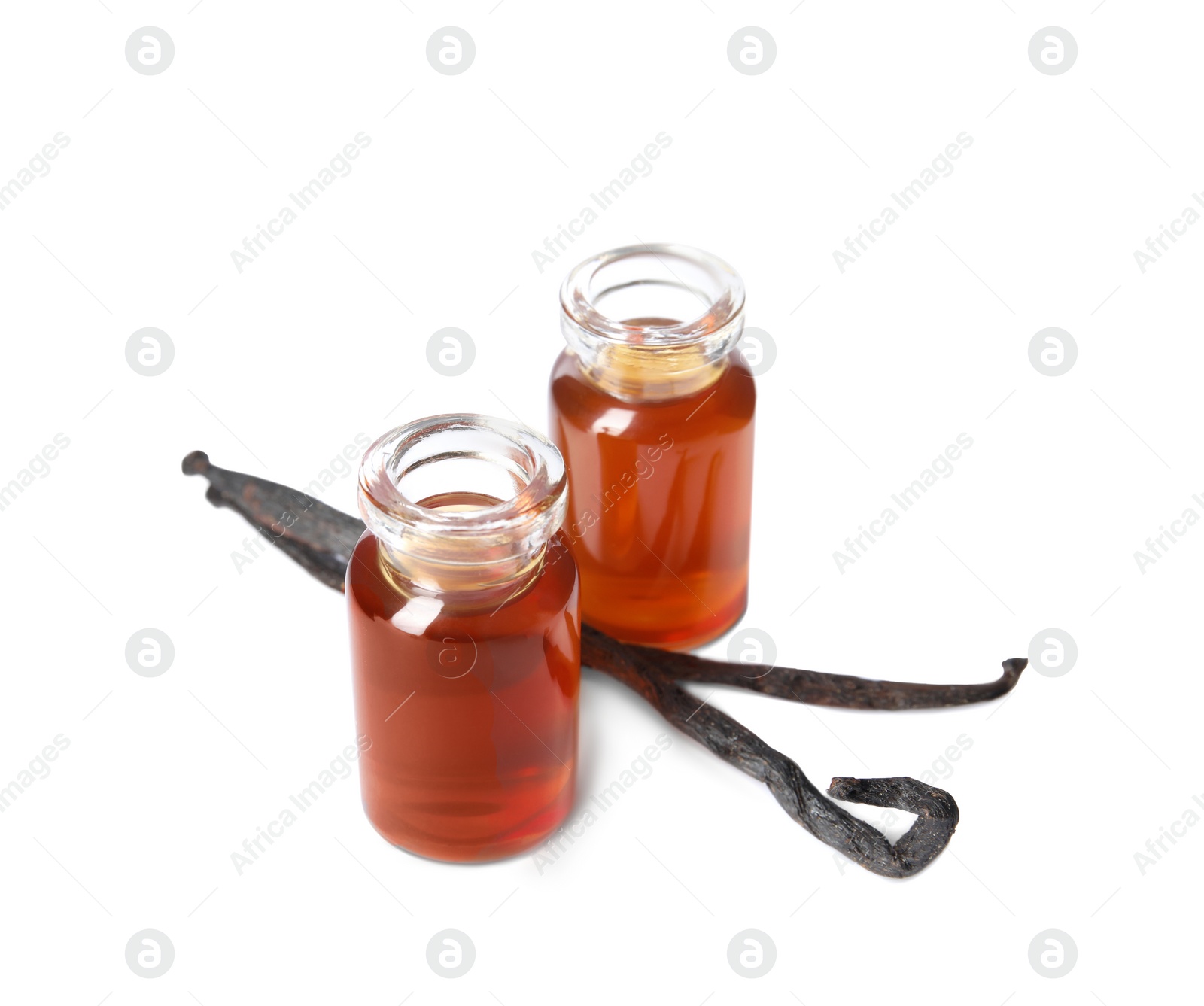 Photo of Vanilla extract and dry pods isolated on white