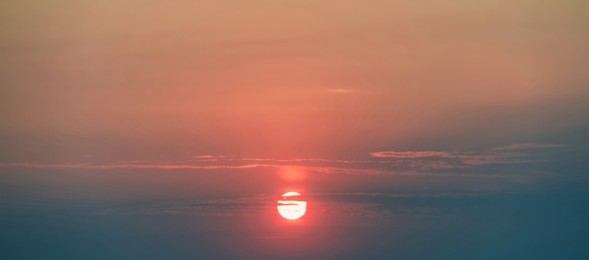 Image of Picturesque sky with sun at sunset. Banner design