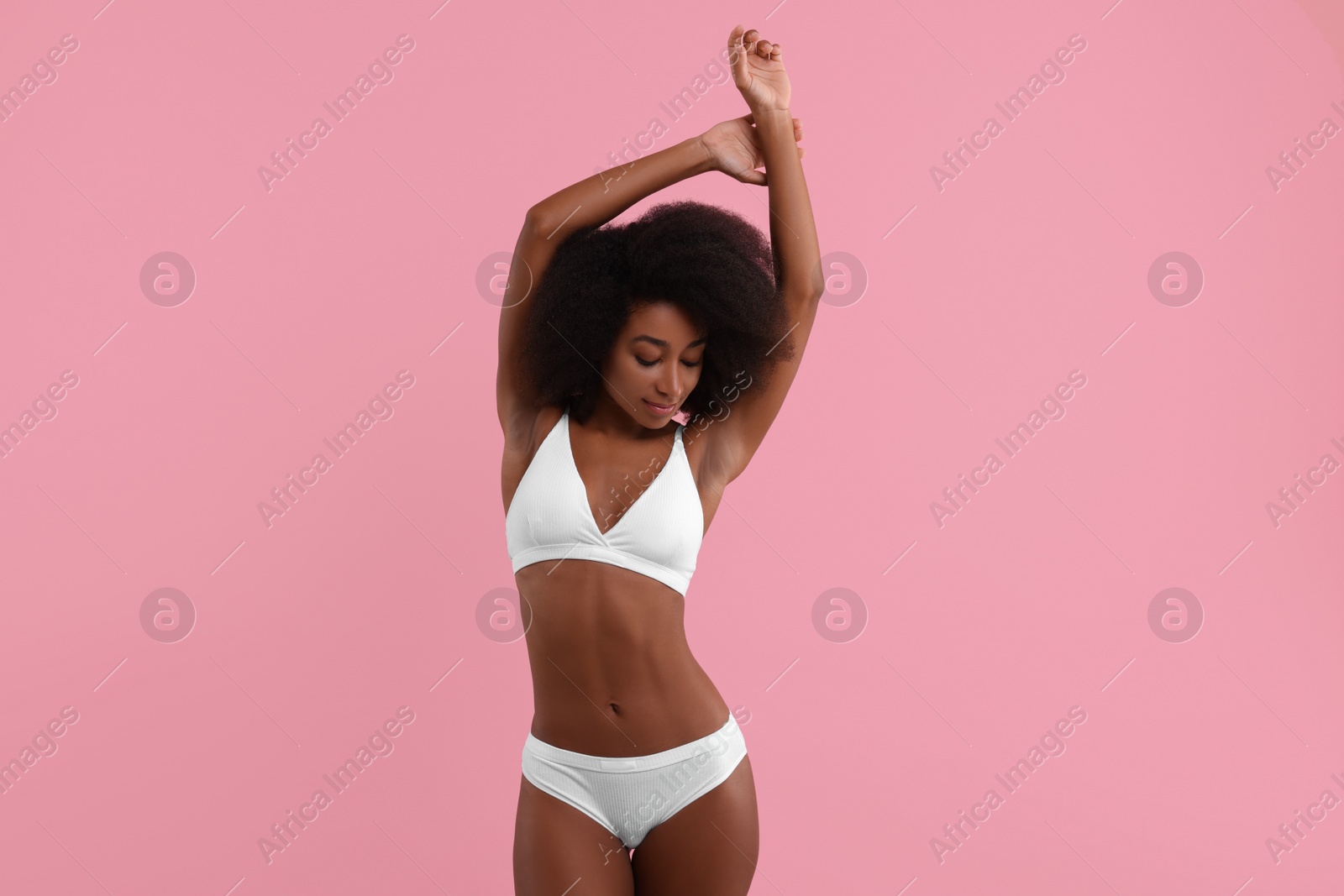 Photo of Beautiful woman in stylish bikini on pink background