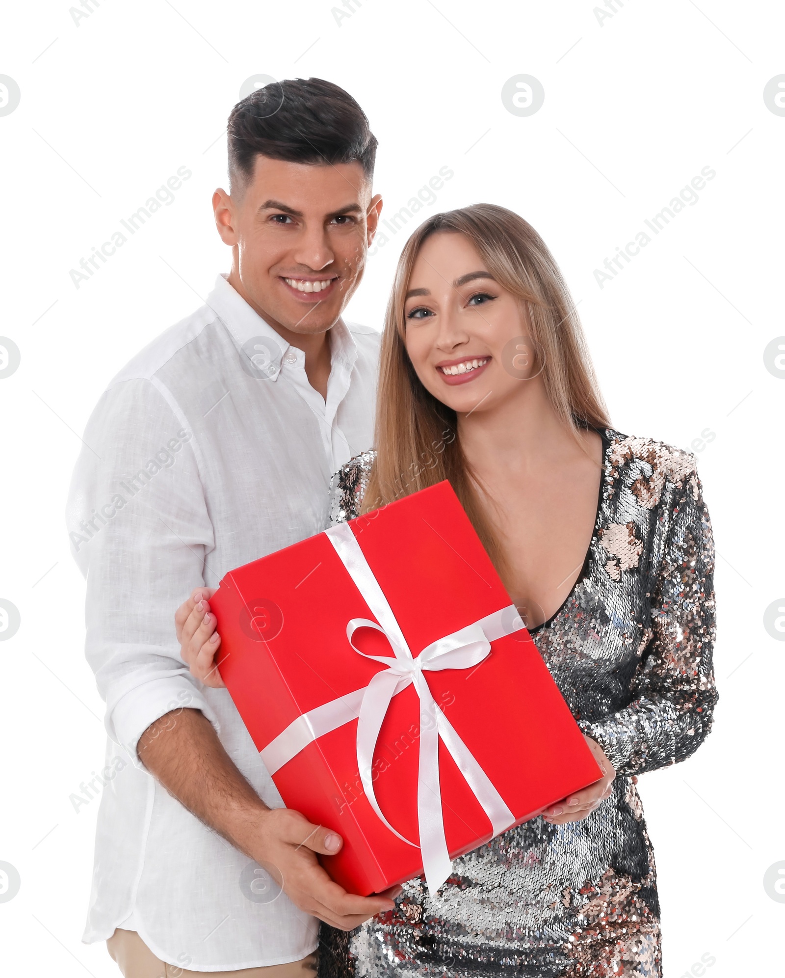 Photo of Lovely couple with gift box on white background. Valentine's day celebration