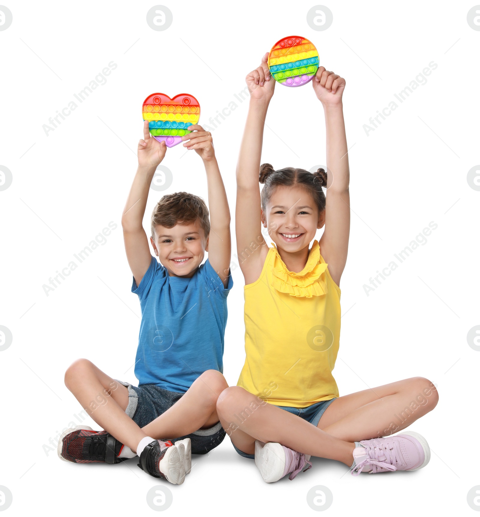 Photo of Children with pop it fidget toys on white background