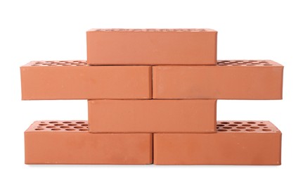 Many red bricks on white background. Building material