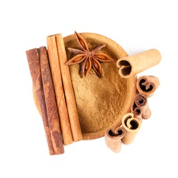 Photo of Dry aromatic cinnamon sticks, powder and anise star isolated on white, top view