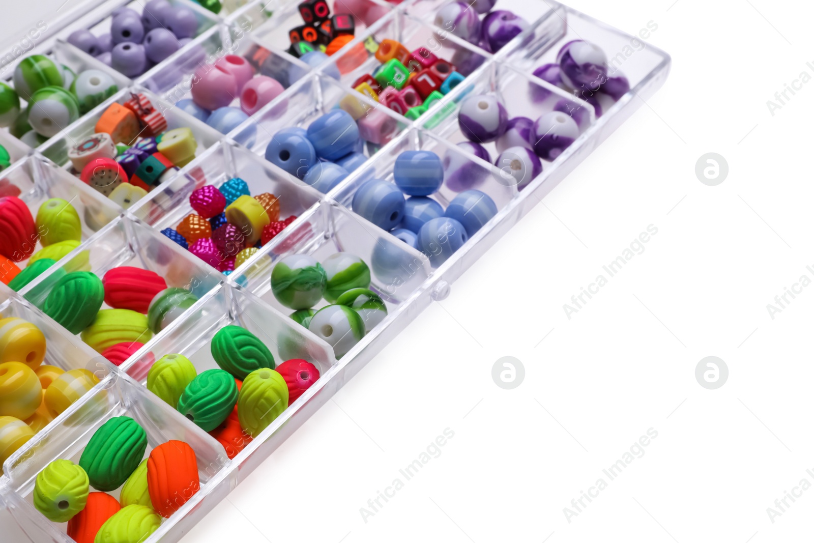 Photo of Plastic organizer with different beads on white background. Space for text