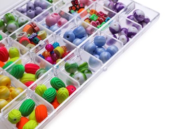 Photo of Plastic organizer with different beads on white background. Space for text