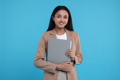 Photo of Beautiful secretary with folder on light blue background