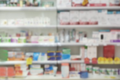 Shelves with pharmaceuticals in drugstore, blurred view