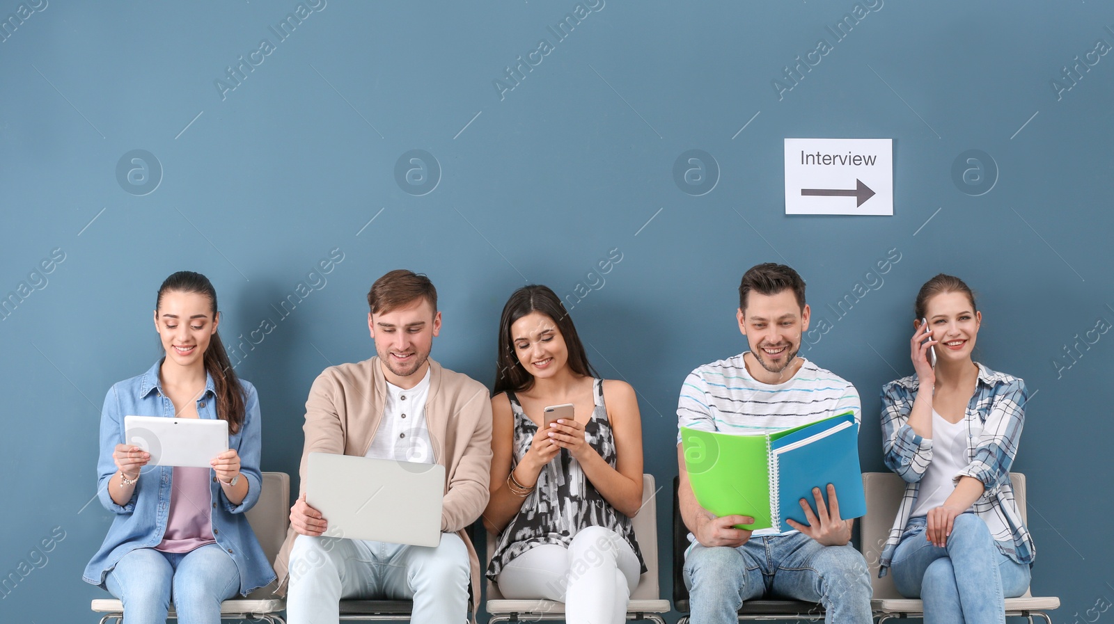 Photo of Group of people waiting for job interview, indoors