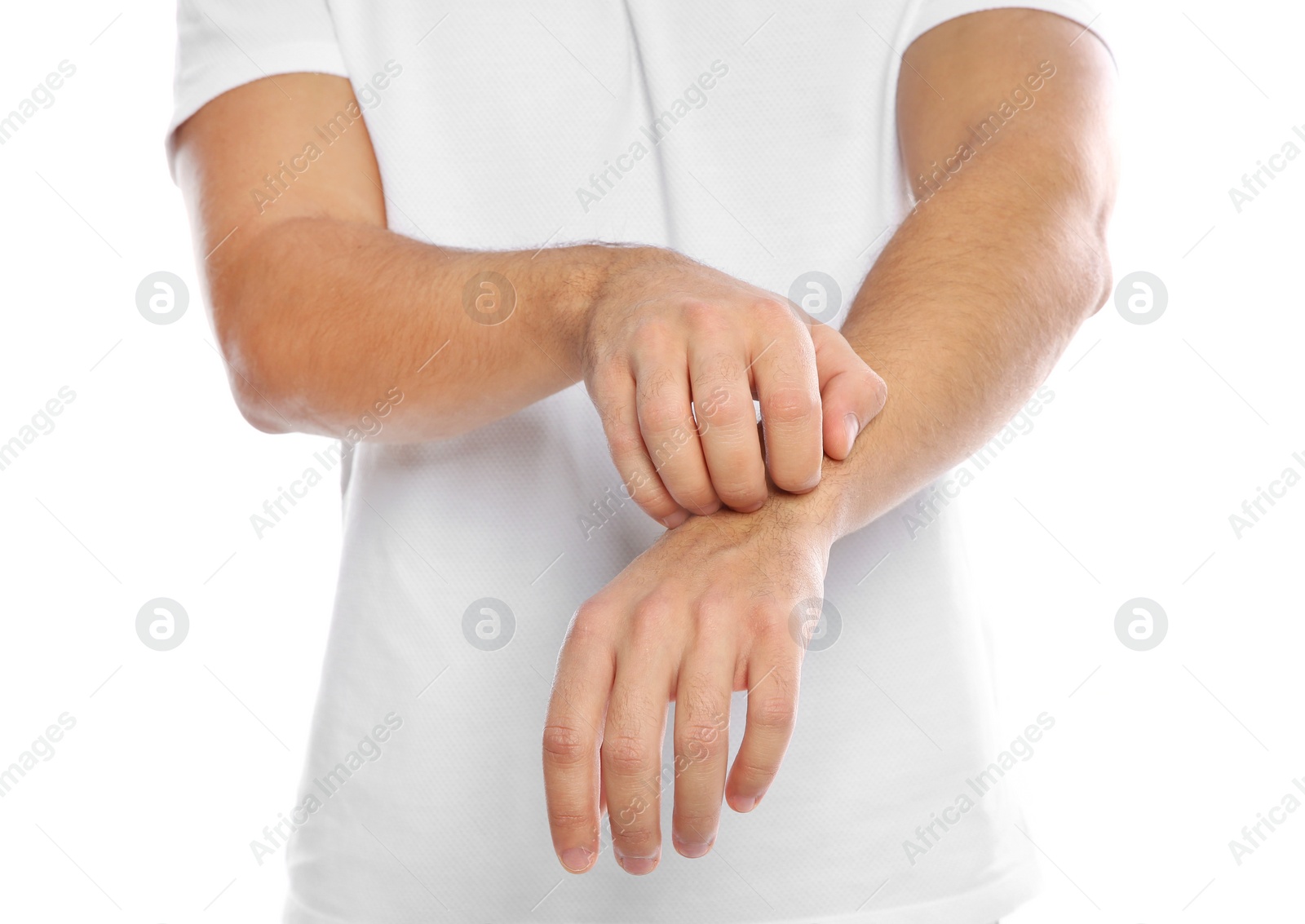 Photo of Young man scratching arm on white background, closeup. Annoying itch