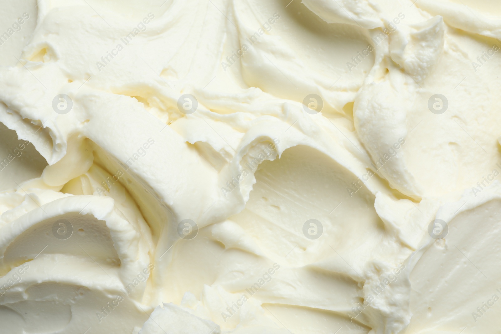 Photo of Closeup of tasty cream cheese as background, top view