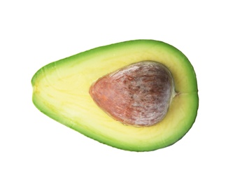 Half of ripe avocado with pit on white background