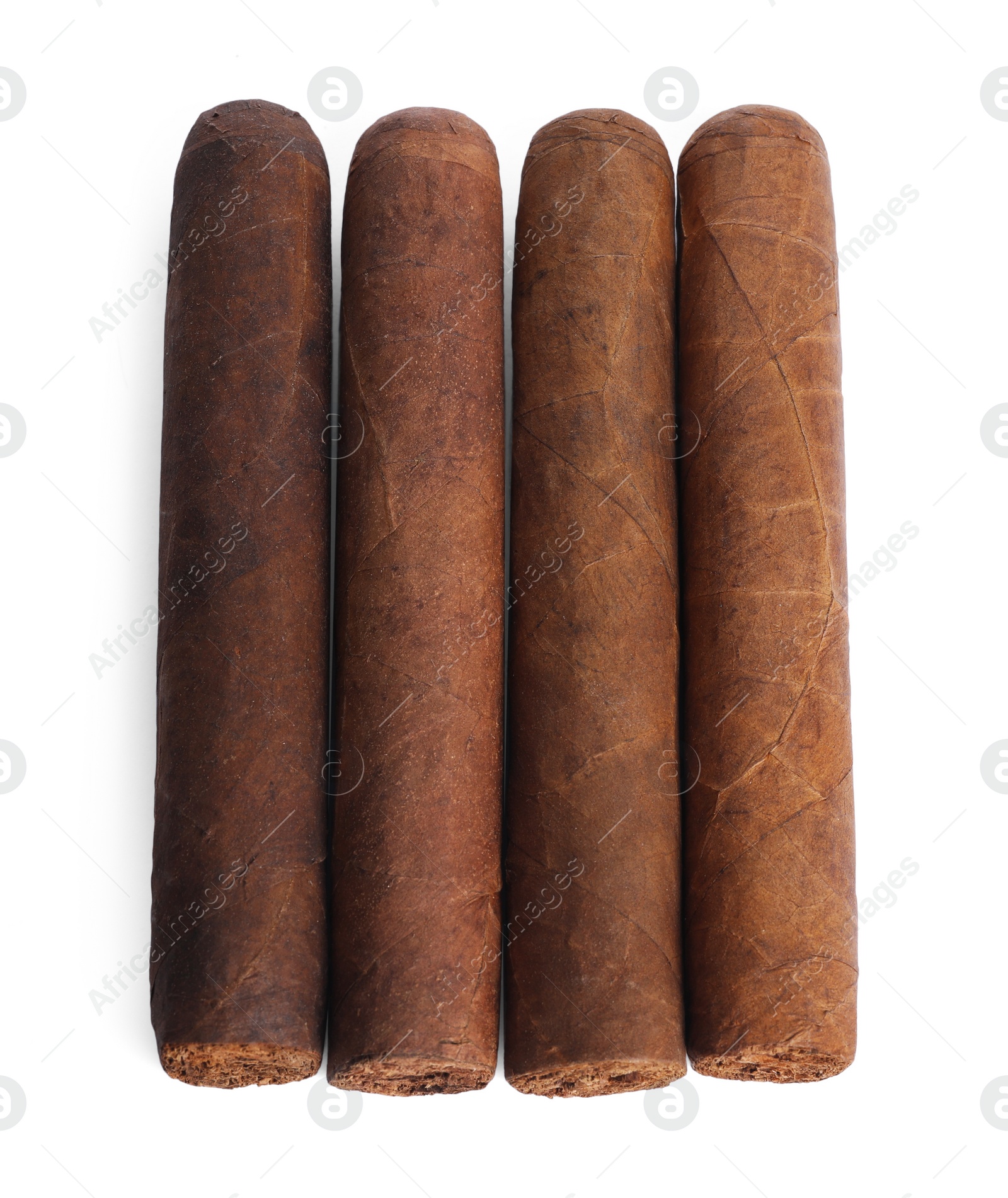 Photo of Cigars wrapped in tobacco leaves isolated on white, top view