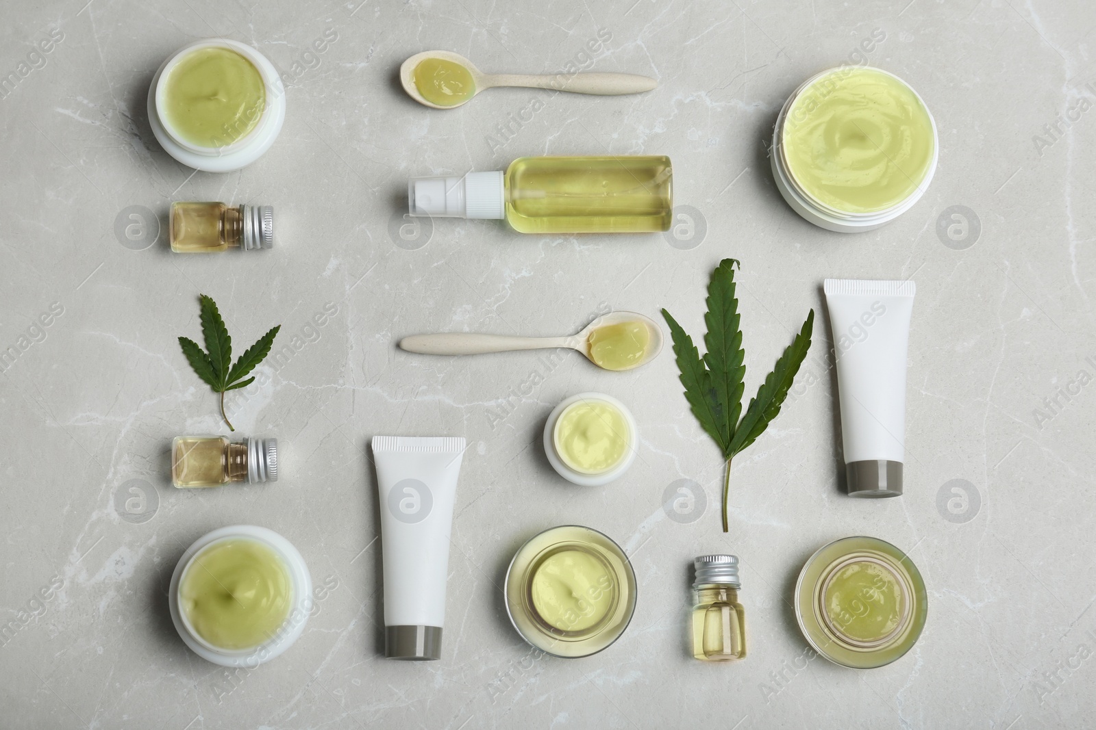 Photo of Flat lay composition with hemp lotion on grey background