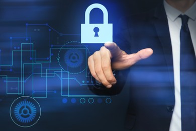 Image of Cyber security concept. Man pointing at virtual screen with padlock icon on dark background, closeup