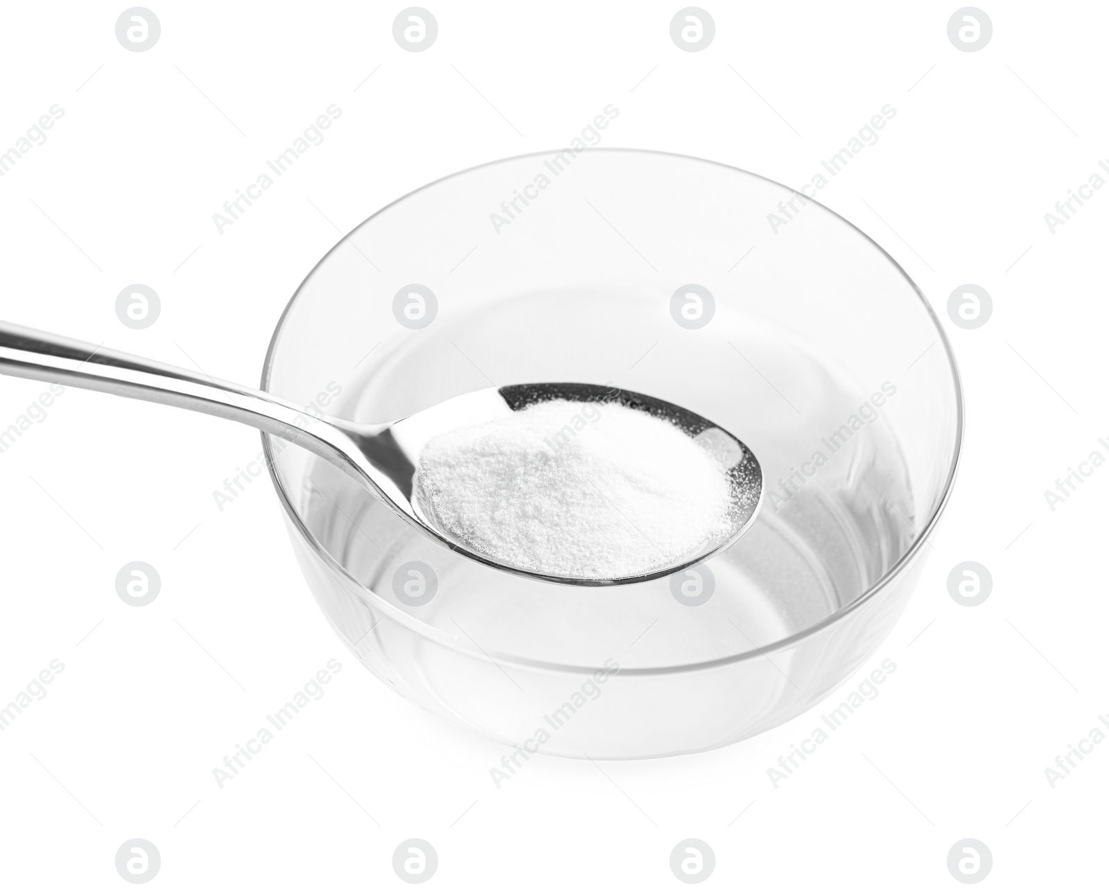 Photo of Spoon with baking soda over glass of water on light background, closeup