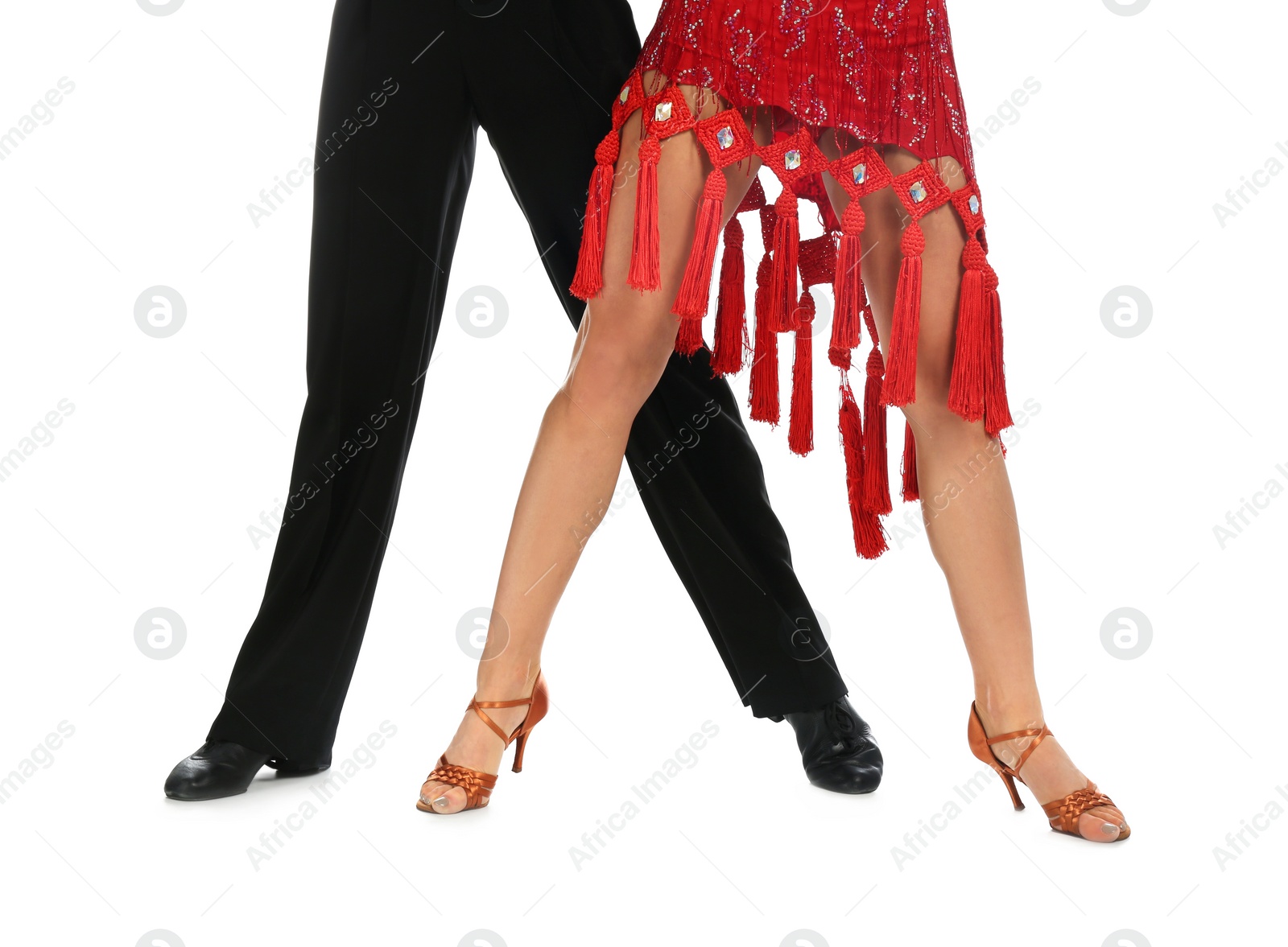 Photo of Young couple dancing on white background, closeup of legs