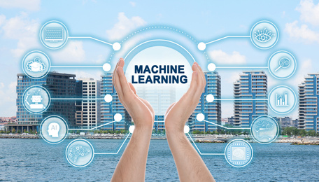 Image of Man demonstrating machine learning model with linked icons and cityscape on background, closeup