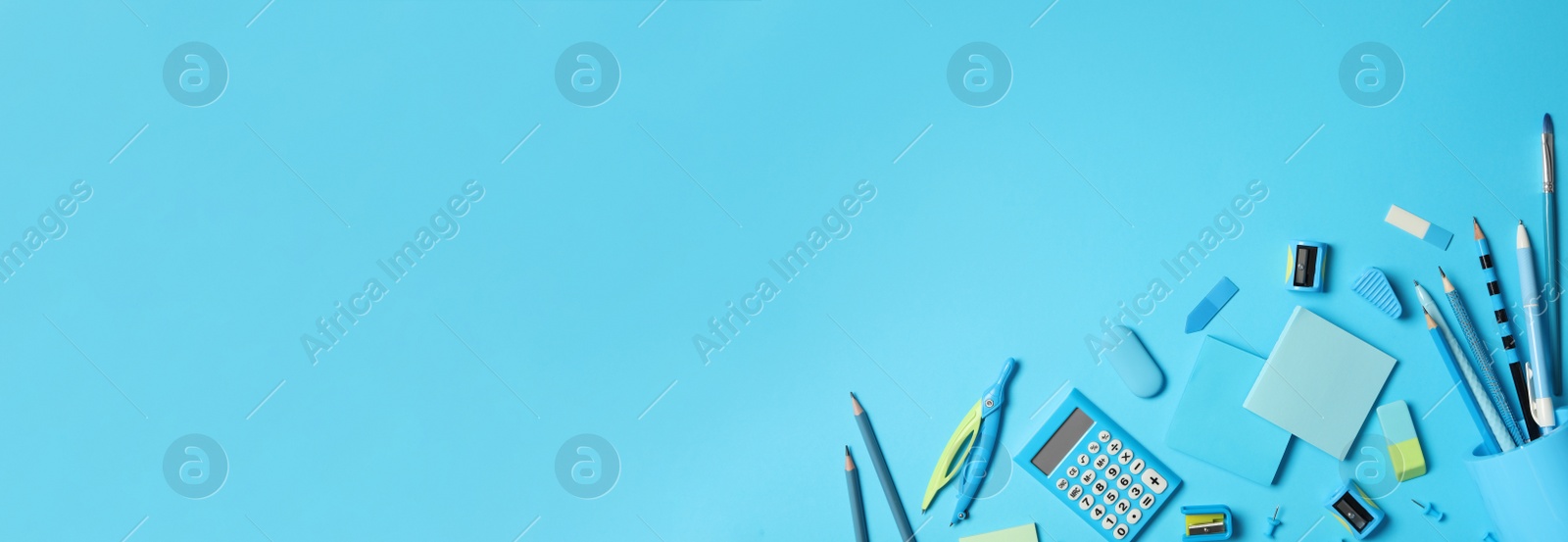 Image of Different stationery on light blue background, flat lay with space for text. Banner design