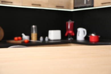 Photo of Countertop and blurred view of kitchen interior on background