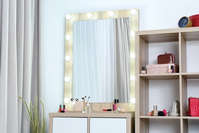 Dressing room interior with makeup mirror, table and shelving unit