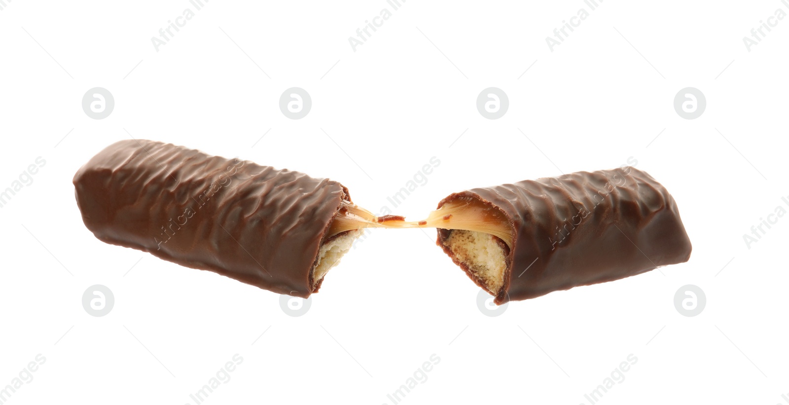 Photo of Pieces of chocolate bar with caramel on white background