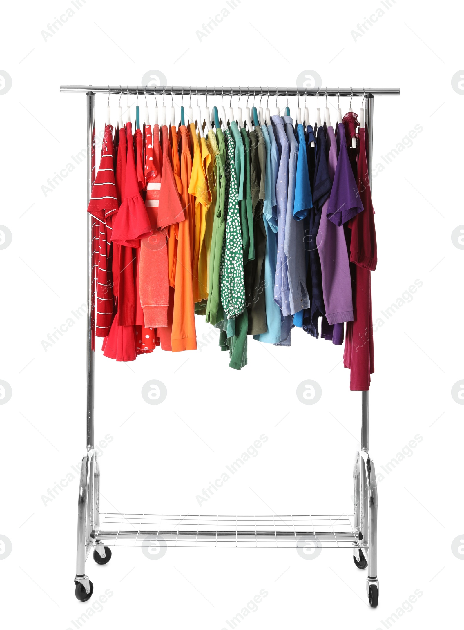 Photo of Wardrobe rack with different colorful clothes on white background