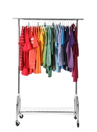 Photo of Wardrobe rack with different colorful clothes on white background