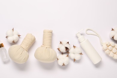 Photo of Bath accessories. Different personal care products and cotton flowers on white background, flat lay