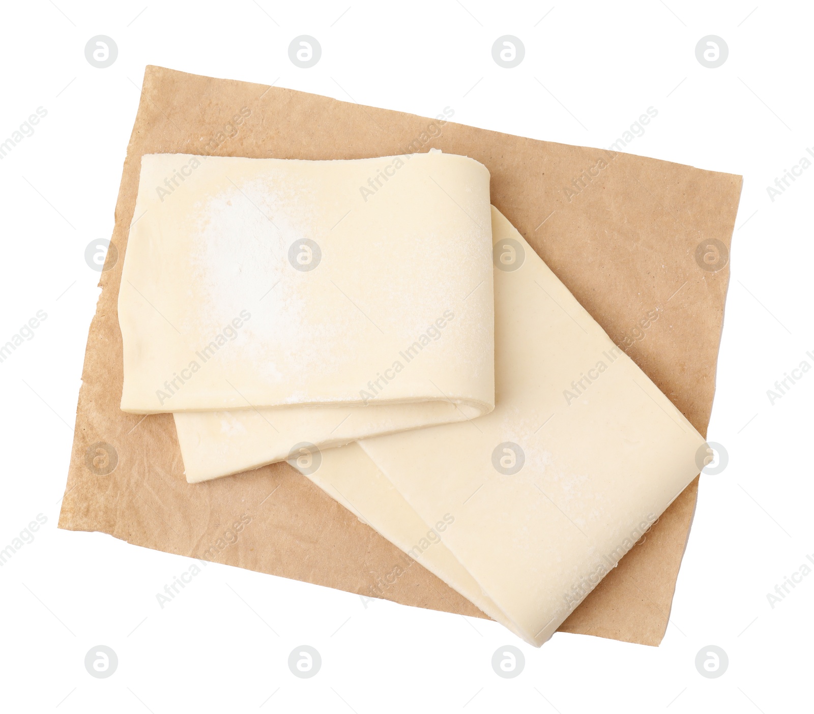 Photo of Raw puff pastry dough isolated on white, top view