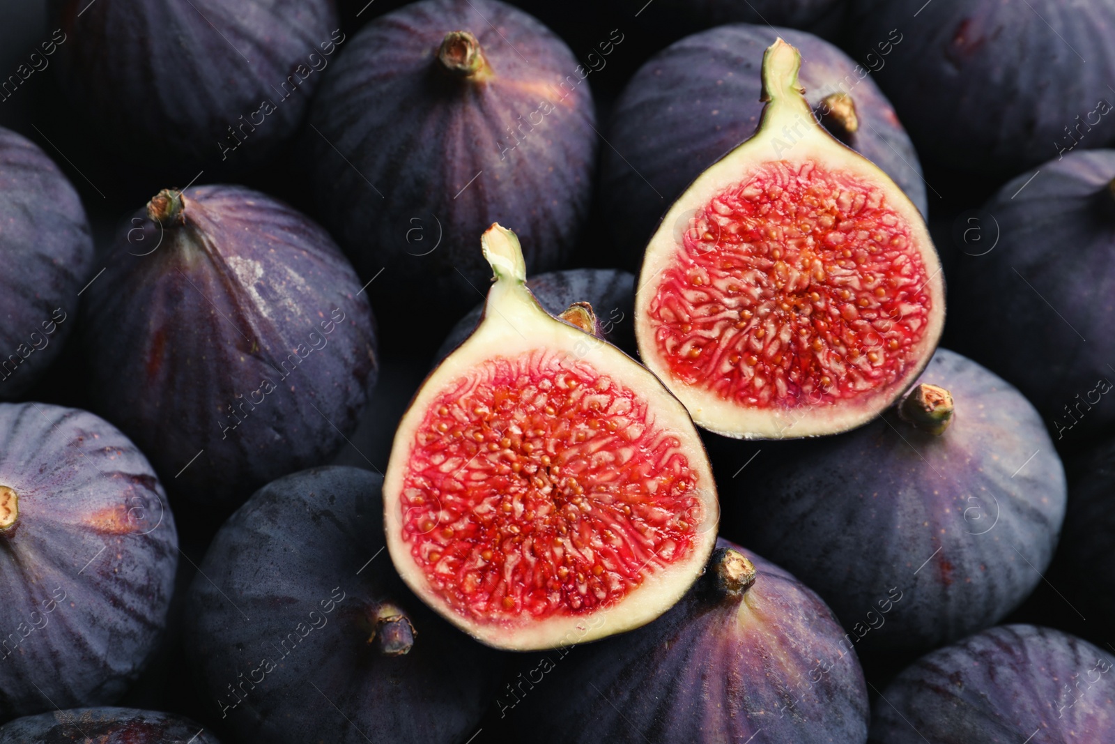 Photo of Fresh ripe figs as background, top view. Tropical fruit