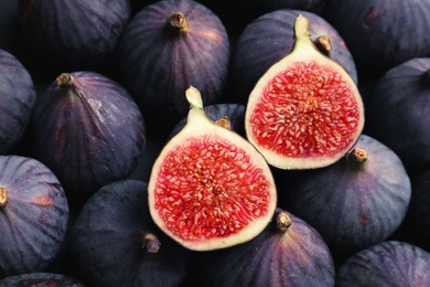 Photo of Fresh ripe figs as background, top view. Tropical fruit