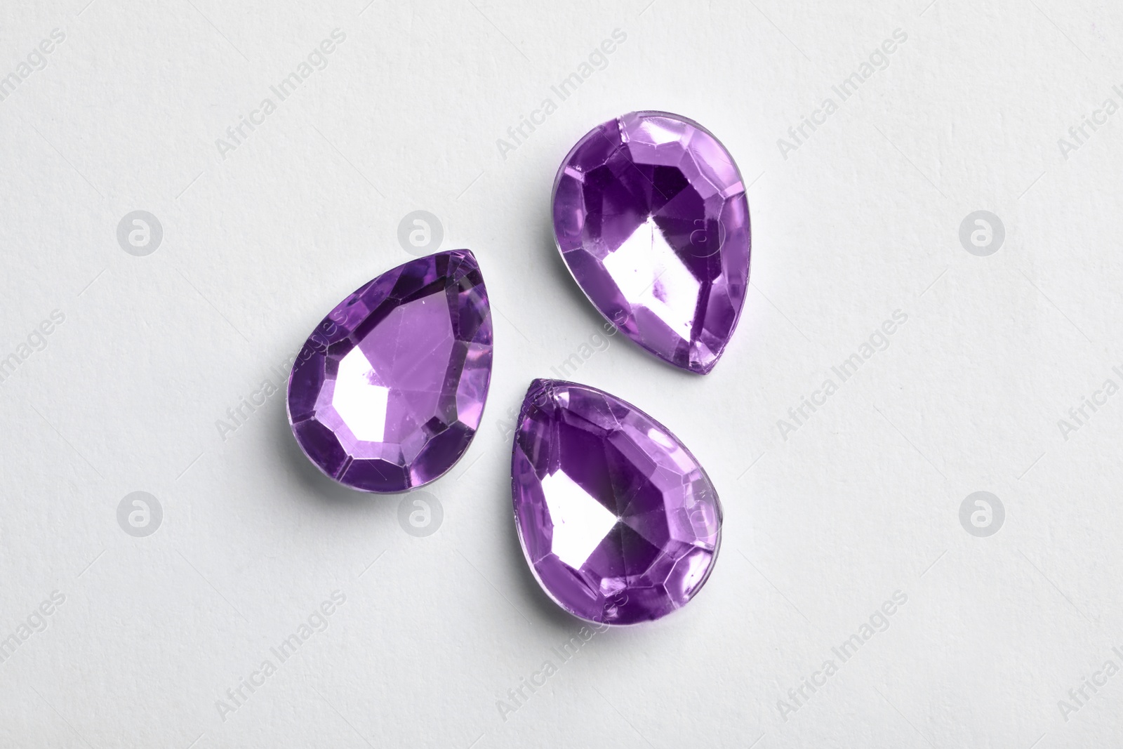 Image of Beautiful gemstones on white background, top view