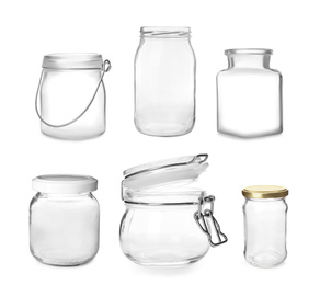 Image of Set with different empty glass jars on white background