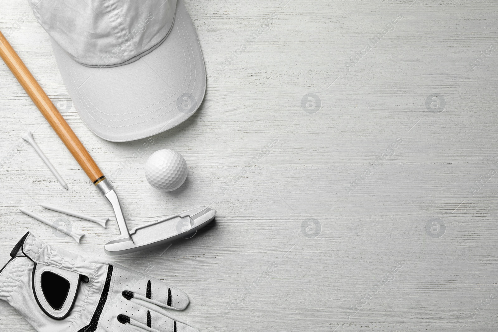 Photo of Flat lay composition with golf accessories and space for text on white wooden background
