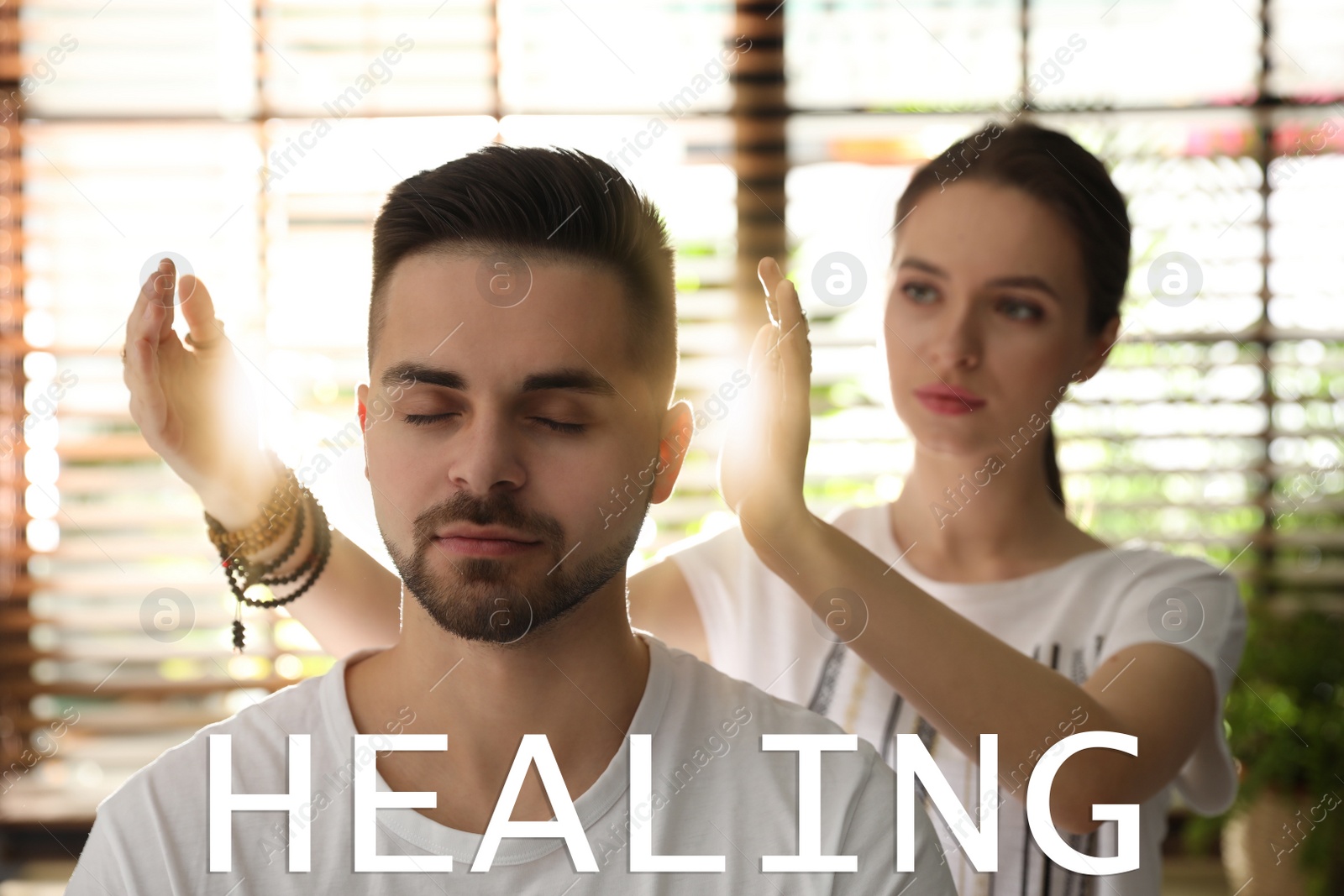 Image of Young man during healing session in therapy room