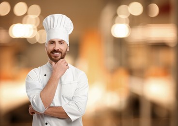 Image of Smiling chef in uniform at restaurant, space for text