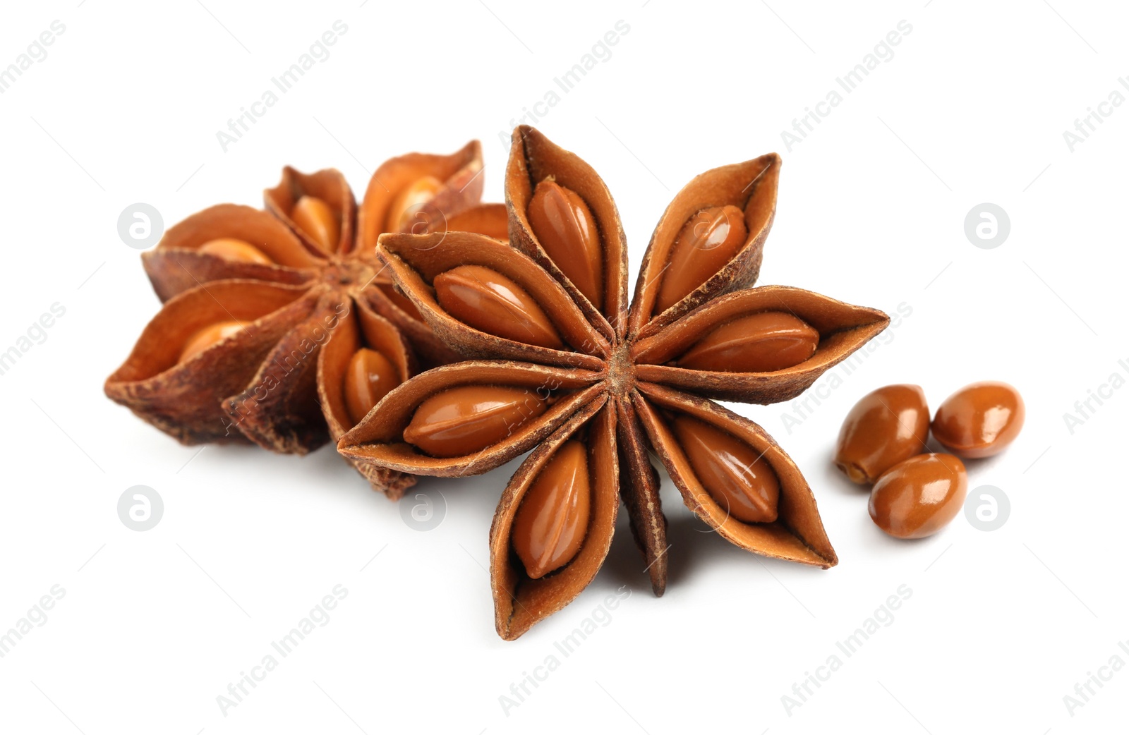 Photo of Dry anise stars with seeds on white background