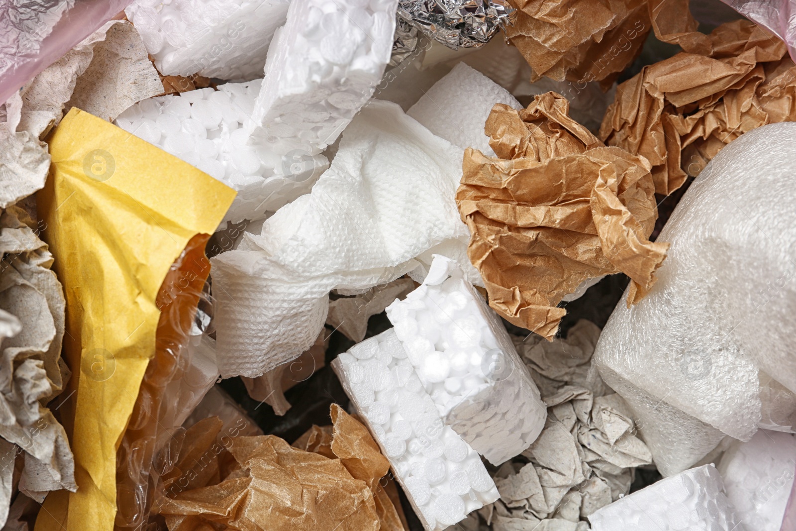 Photo of Pile of different garbage as background, top view. Recycling problem