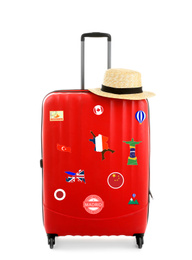 Image of Red suitcase with travel stickers on white background