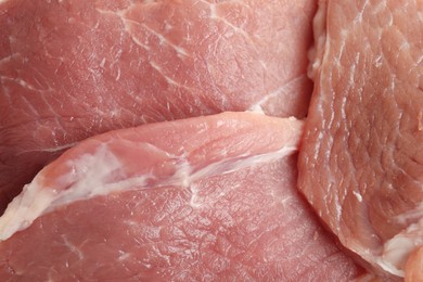 Photo of Pieces of raw meat as background, closeup view