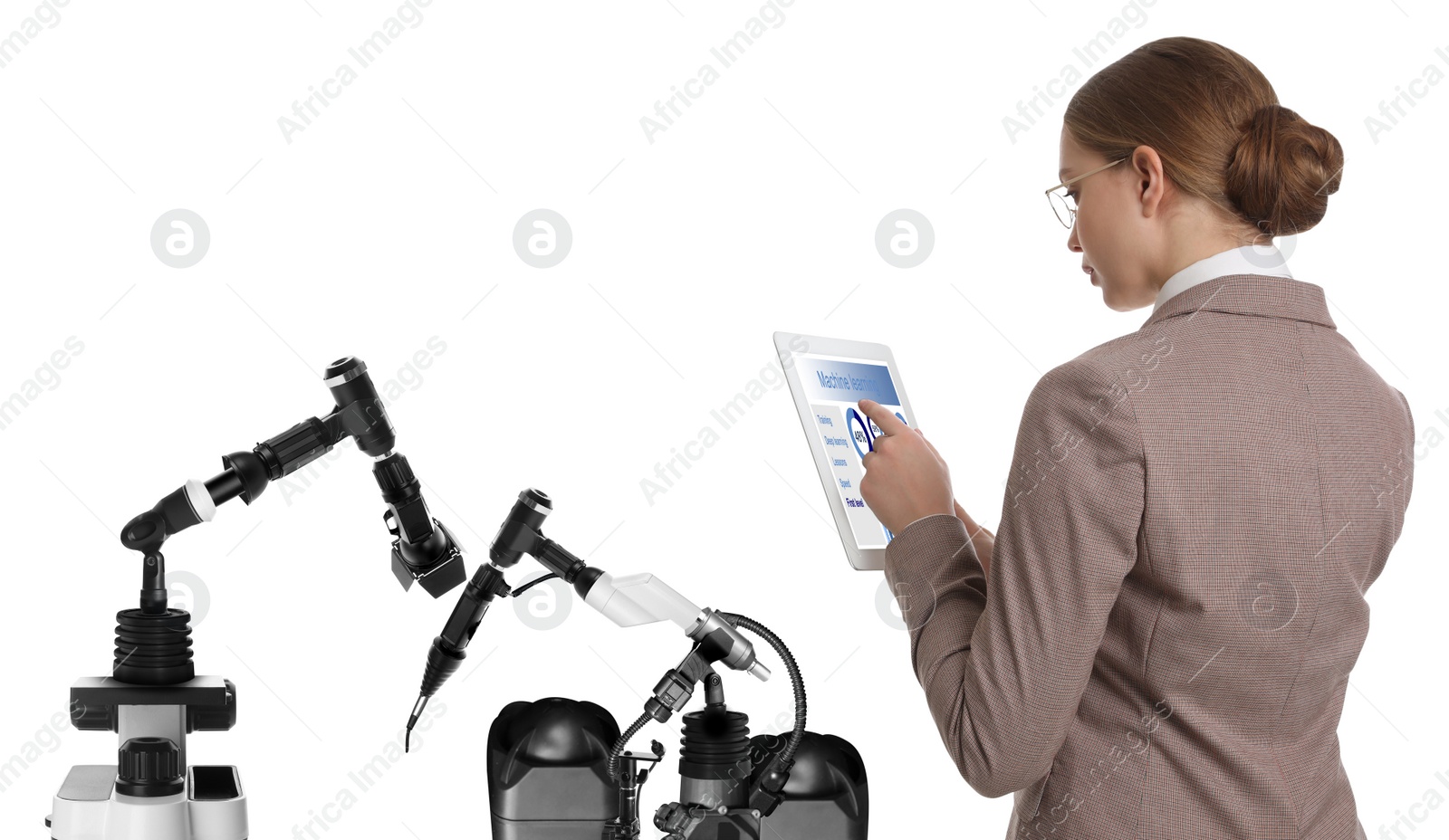 Image of Engineer controlling electronic laboratory robot manipulators with tablet on white background. Machine learning