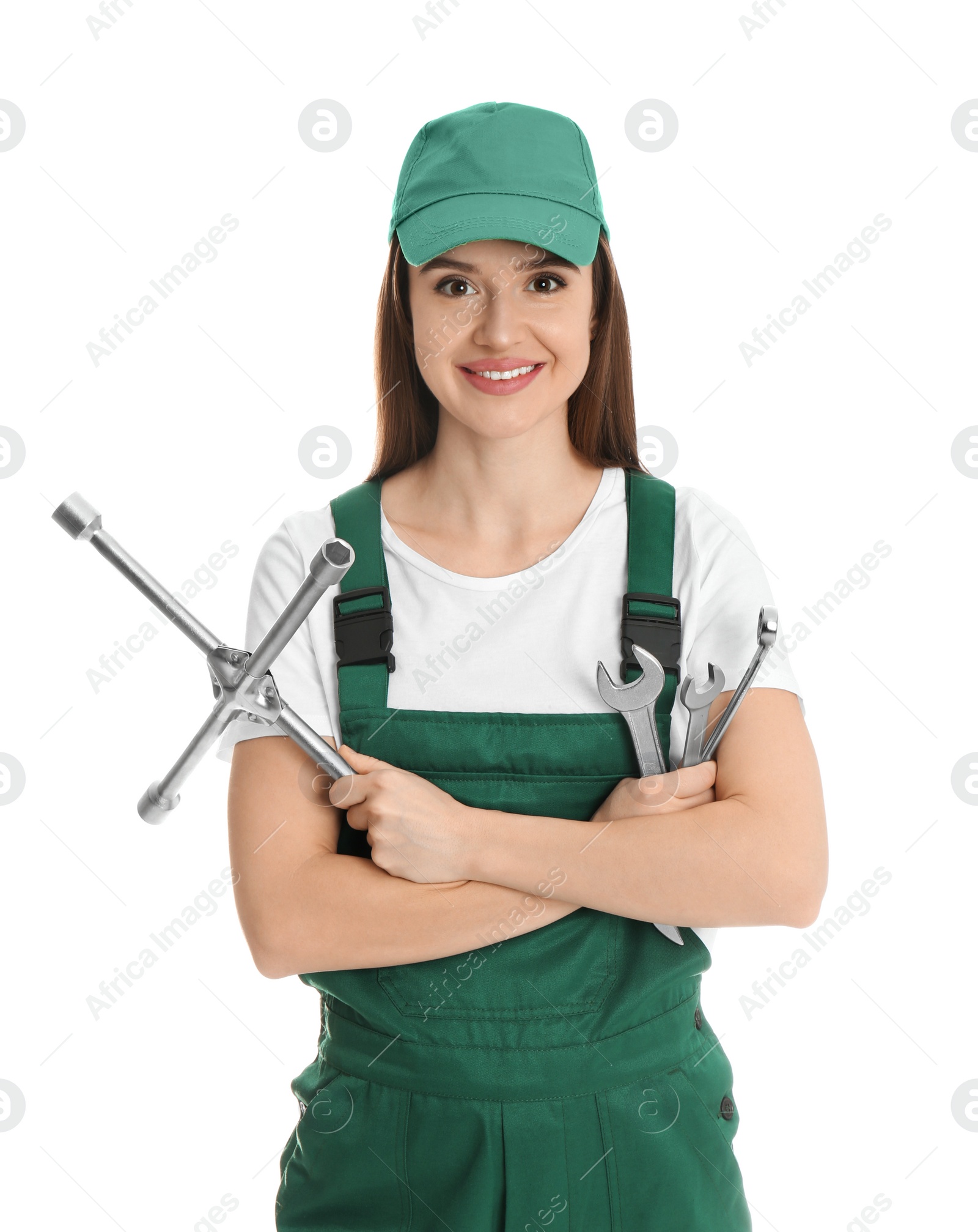 Photo of Portrait of professional auto mechanic with wrenches on white background