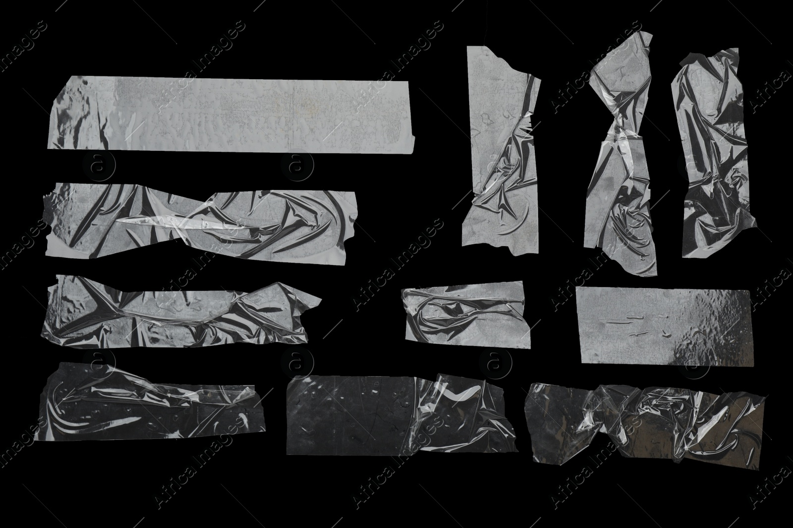 Photo of Many pieces of transparent adhesive tape on black background, flat lay