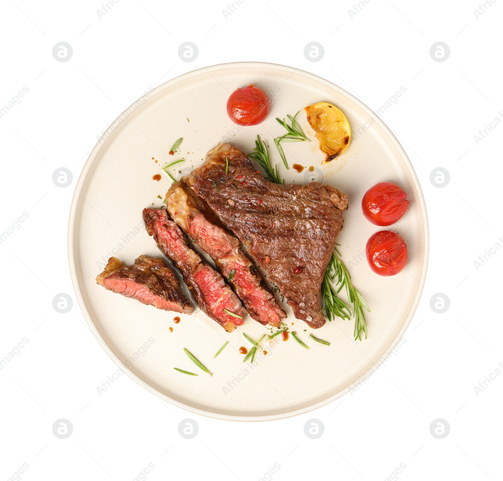 Photo of Plate with delicious grilled beef steak, tomatoes, rosemary and lemon slice isolated on white, top view
