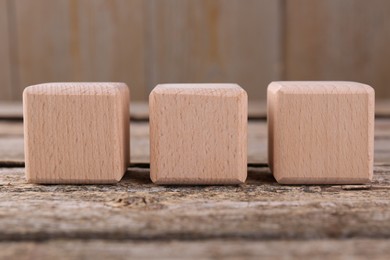 Photo of International Organization for Standardization. Cubes with abbreviation ISO on wooden table, closeup