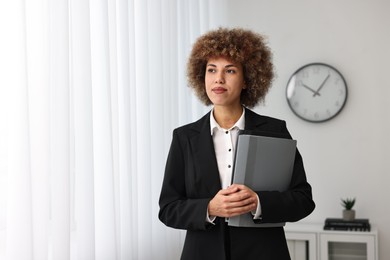 Photo of Notary with folders in office, space for text