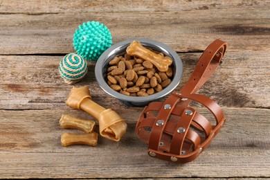 Photo of Different pet goods on wooden table. Shop assortment