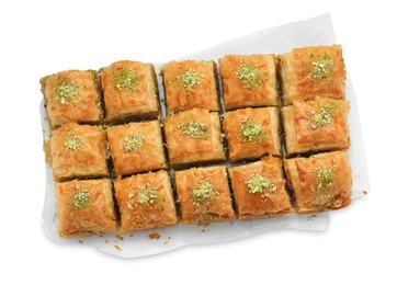 Delicious fresh baklava with chopped nuts isolated on white, top view. Eastern sweets