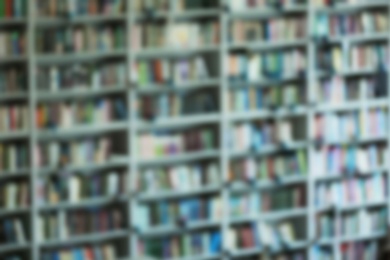 Photo of Blurred view of shelves with books in library